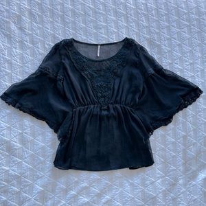 Sheer black top with lace crochet detailing